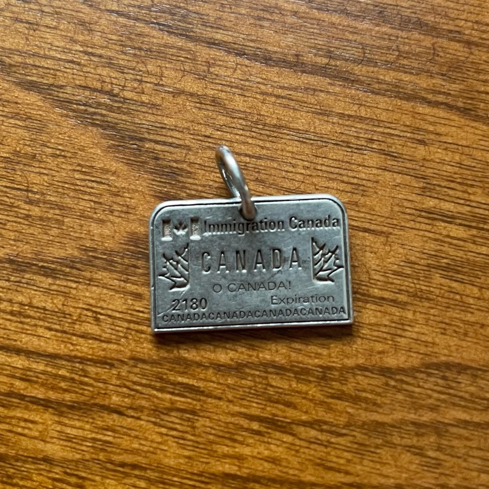 Silver Canada Passport Stamp Charm from Jet Set Candy